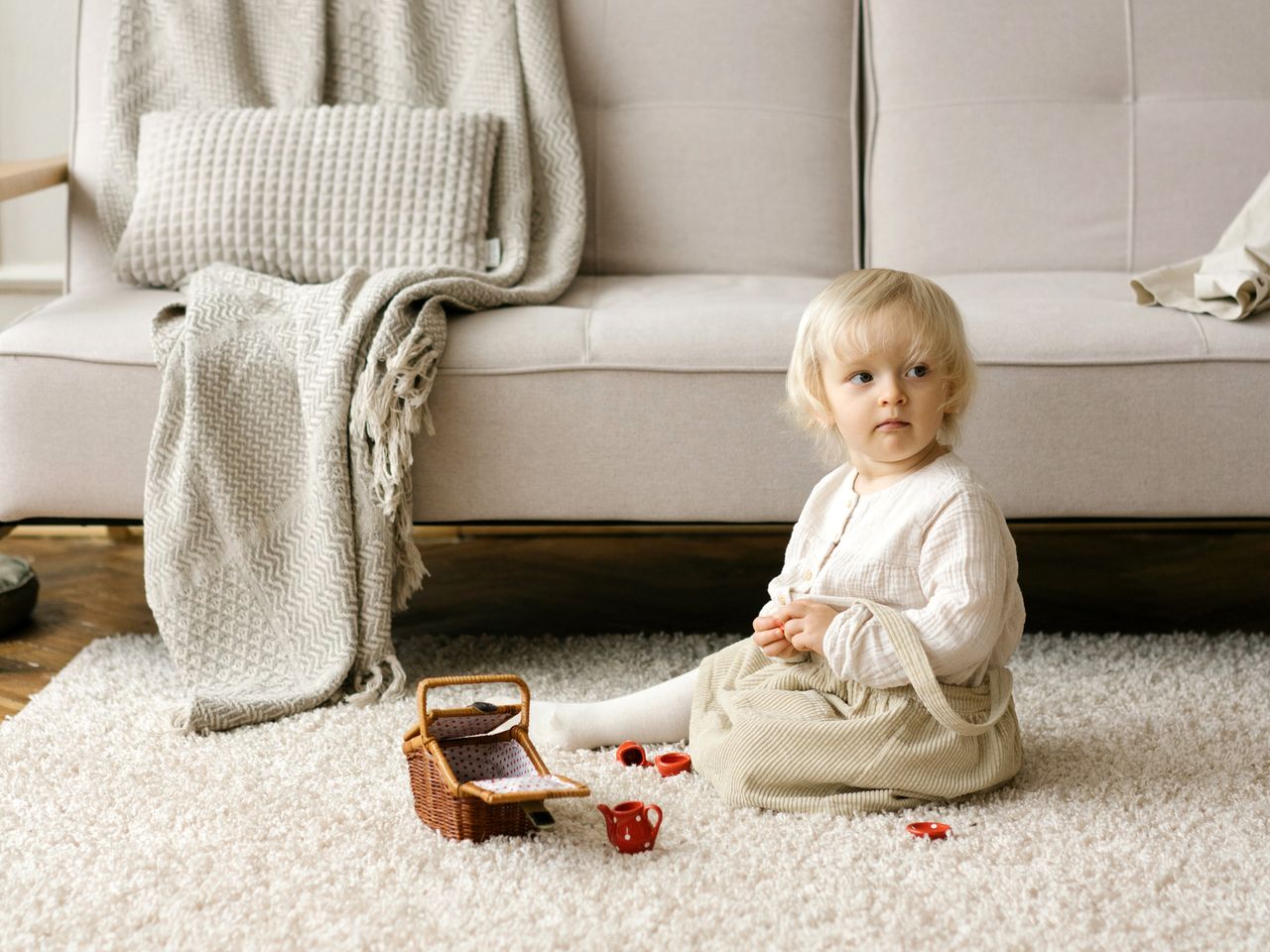 Toddler playing on a freshly cleaned living room floor